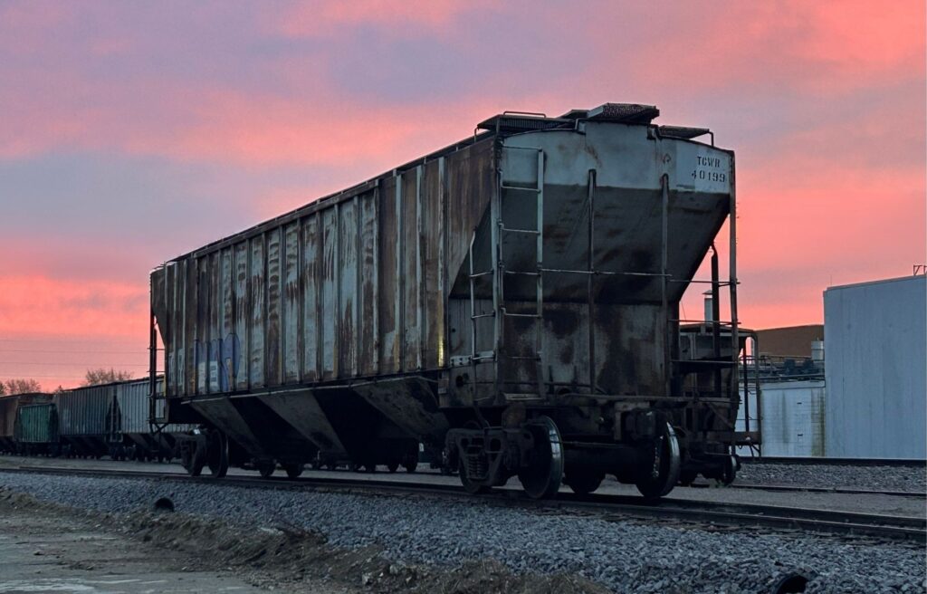 An empty rail car at dawn ready to carry chicken manure pellets across the US